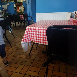 a table with a red and white checkered tablecloth