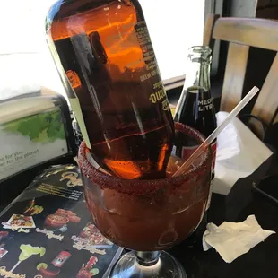 a drink in a glass with a spoon