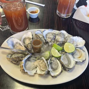 A dozen oysters and 2 micheladas
