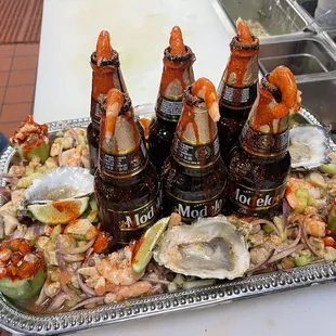 a platter of seafood and beer