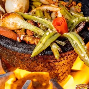 a bowl of food on fire