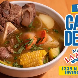 a bowl of soup with meat and vegetables