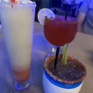 Piña colada, strawberry margarita, and paloma
