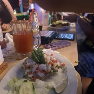 Ceviche tostada and tacos
