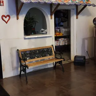 a bench in front of a window