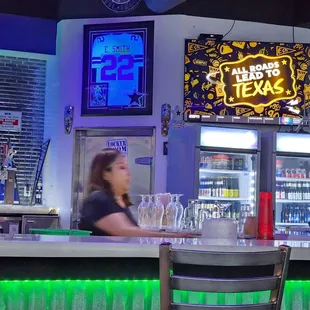 a woman sitting at a bar