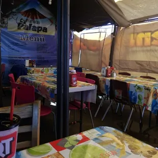 tables and chairs in a tent