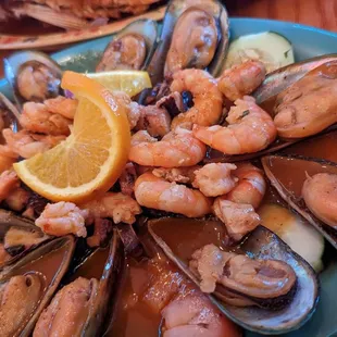 a plate of mussels and shrimp