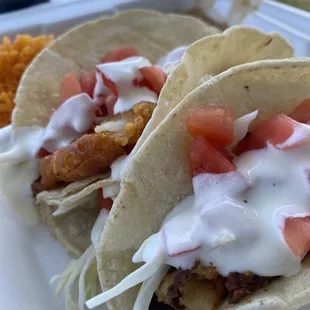 3 fish taco plate with beans &amp; rice and a pineapple aguasfresca.