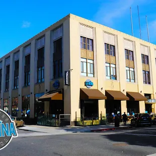 a building with a clock tower in the background