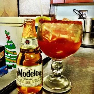 a bottle and a glass of modelos