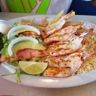 Grilled Shrimp plate with fries,rice,and salad