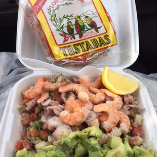 Four tostadas Togo with everything for only 10$ she even just threw the whole bag of tostadas chips thanks