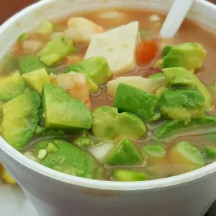 Container packed with seafood cocktail