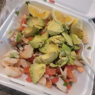 a salad in a styrofoam container