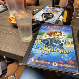 a menu and a drink