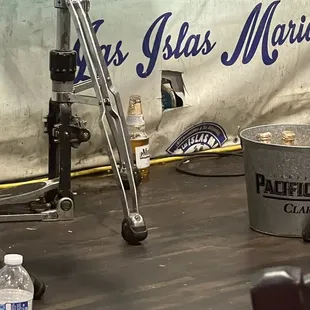 a bucket of water and a water bottle on a table