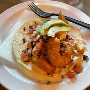 a plate of fish tacos