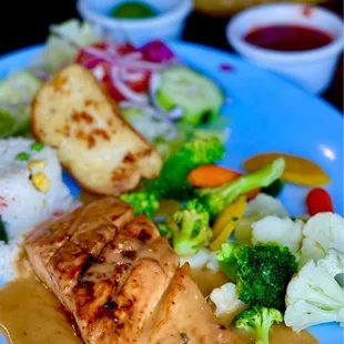 Grilled salmon with garlic sauce.