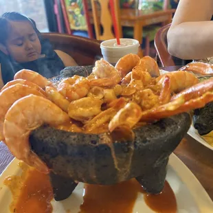 Shrimp, crab legs, mussels and octopus molcajete