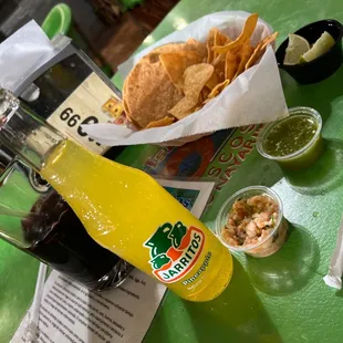 a bottle of beer and chips