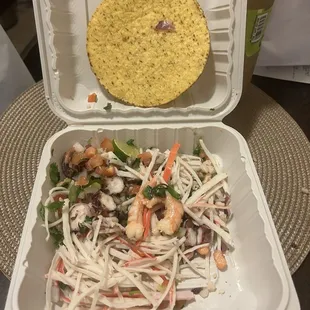 a meal in a styrofoam container