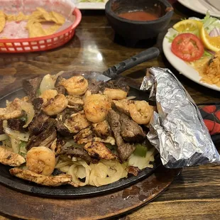 Steak, chicken, and shrimp fajitas