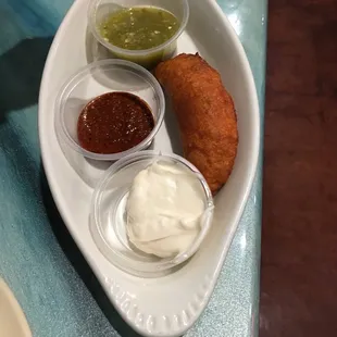 Empanada,sauce is spicy... I think it's better without it.