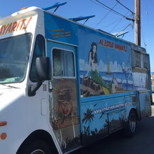 a food truck parked on the side of the road