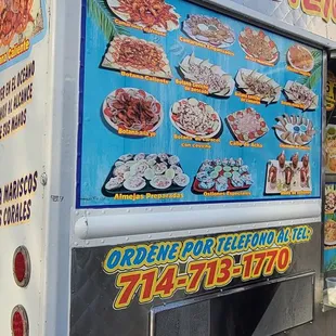 a food truck with a menu on it