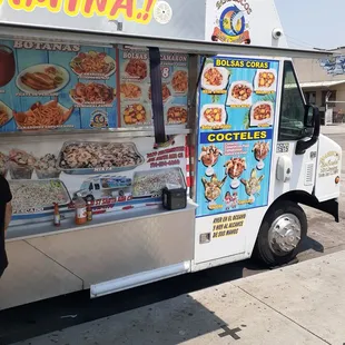 a food truck parked on the side of the road