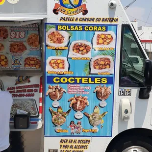 a food truck with a menu