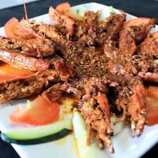 a plate of grilled shrimp