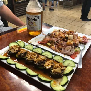 a plate of food and a bottle of beer