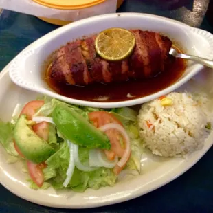 Filete relleno a la plancha. Tilapia filet stuffed with shrimp, octopus and crab, wrapped in bacon with a lime butter sauce.