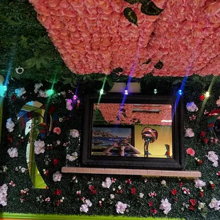 a picture of a woman in a floral room