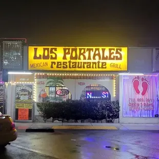 a car parked in front of a restaurant