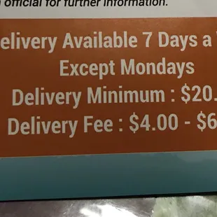 a sign for the delivery available 7 days a week