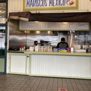 two men behind a counter