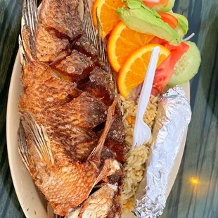 a plate of fish and rice