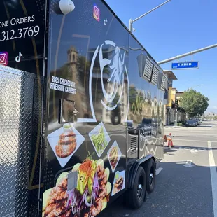 a food truck parked on the side of the road