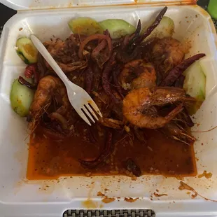 a fork in a styrofoam container