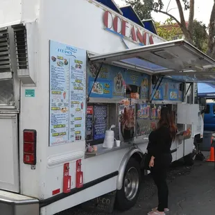 people ordering food from a food truck