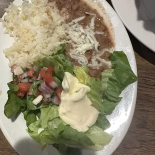 Side of beans, rice and salad