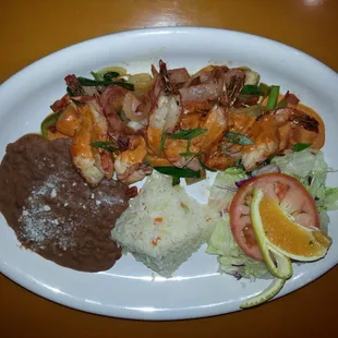 A LA PERLAS SHRIMP. One of my favorite.  A delicious mix of veggies. .bacon..ham..topped with some good spicy house sauce.