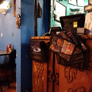 a restaurant counter with magazines on it
