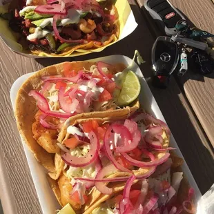 Left, taco Rolex (shrimp with marlin) Right, fish tacos. Added pickled onions.