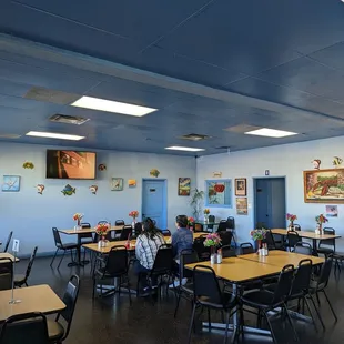 a dining room with tables and chairs