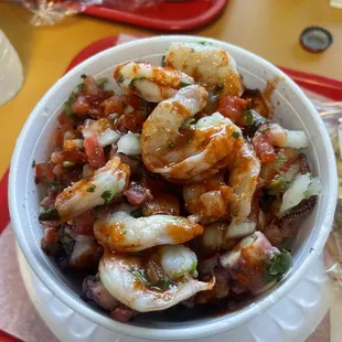 Shrimp and Octopus Cocktail with Tapatío Hot Sauce, green lime and salt.