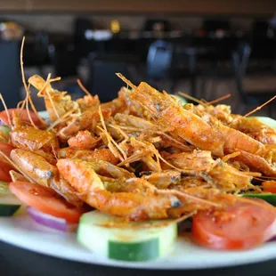 a plate of shrimp and vegetables
